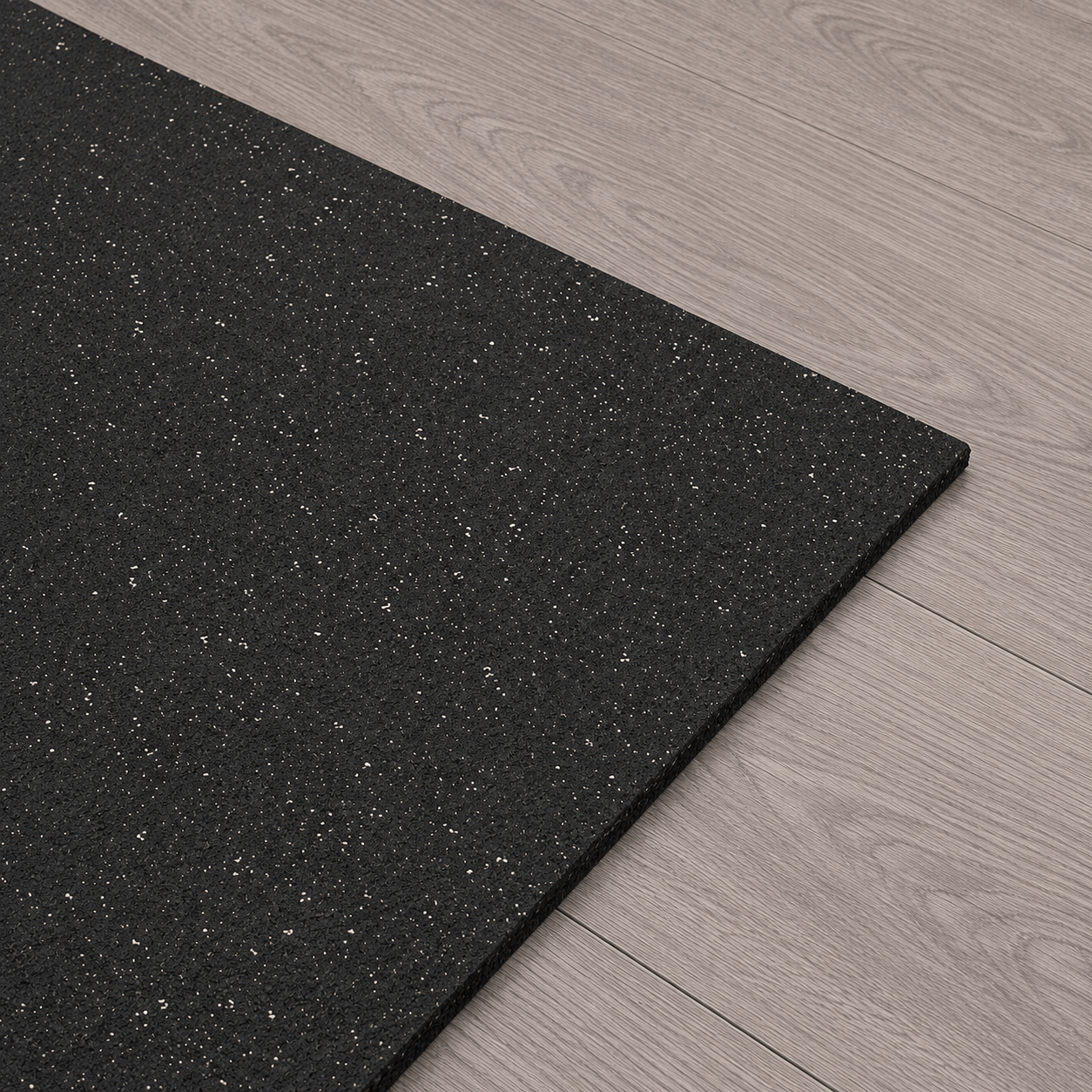 Corner detail of the StepTone rubber gym mat showing texture and thickness